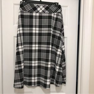 Black and white Plaid skirt with white waistband.  Worn once